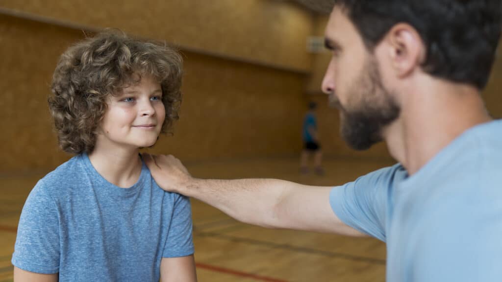 Father and son bonding as the dad encourages his son