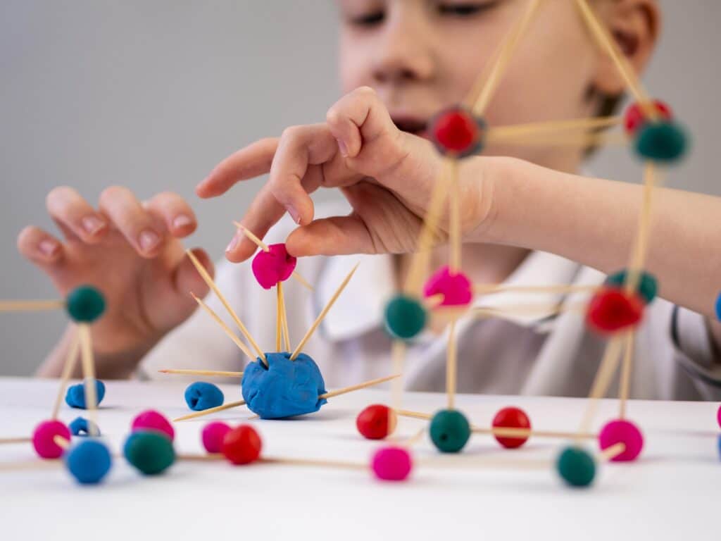 Child playing with playdough for sensory stimulation.