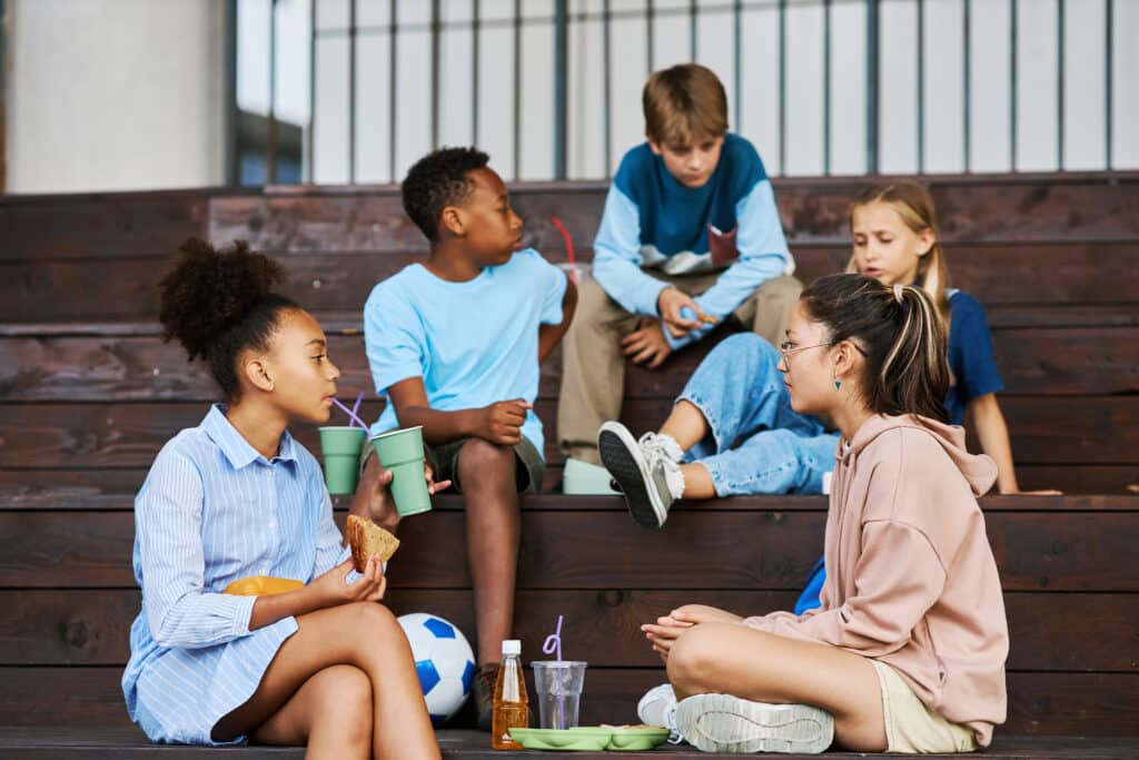 A group of kids hanging out together manifesting social influence.