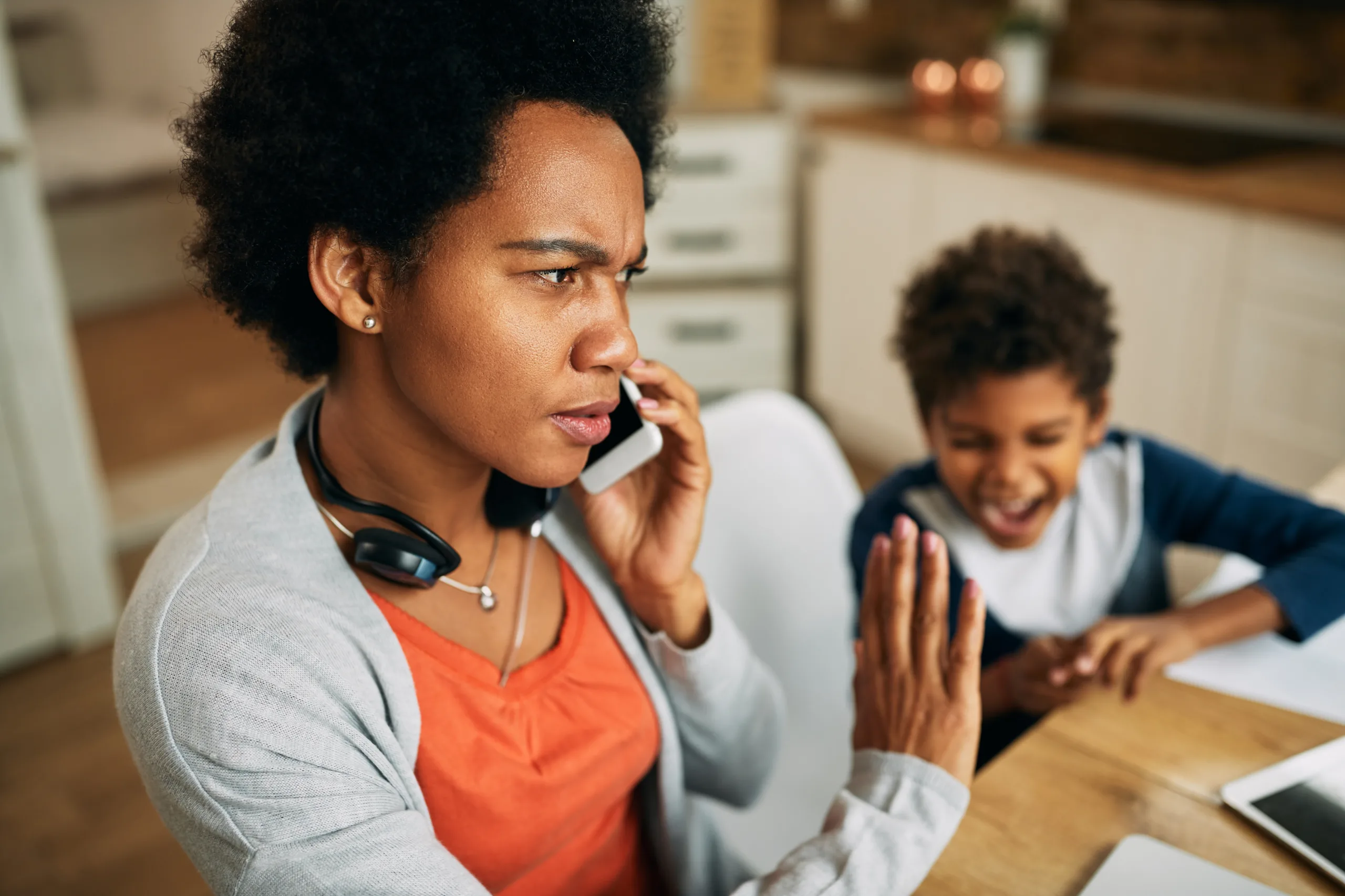 Mom talking on the phone while the son is screaming and demanding attention