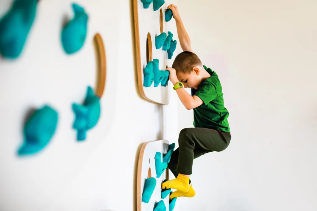 How to control impulsive behavior in child  - Resilient boy indoor wall climbing