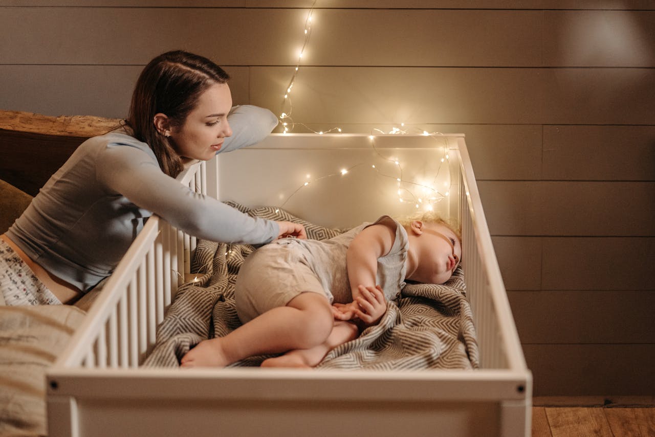 2 Year old sleep regression - mom sitting next to child, while trying to fall asleep