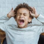 tantrums at 5 years old: little boy shouting