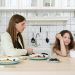 Things a step-parent should never do: mom talking with daughter at breakfast